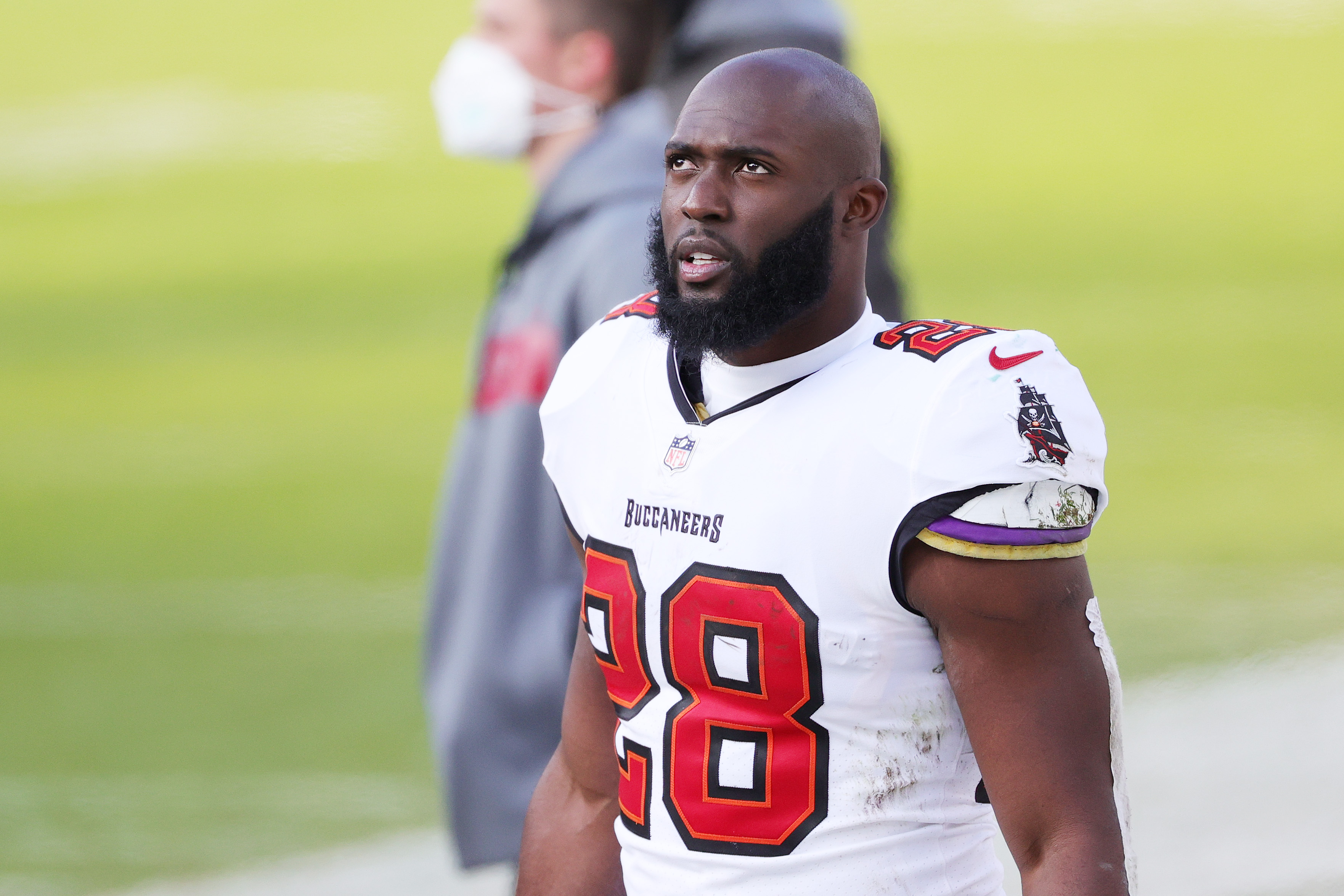 Leonard Fournette of the Tampa Bay Buccaneers looks on from the sideline
