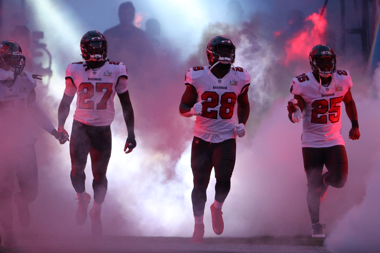 Ronald Jones, Leonard Fournette, and LeSean McCoy of the Tampa Bay Buccaneers take the field before Super Bowl 55.