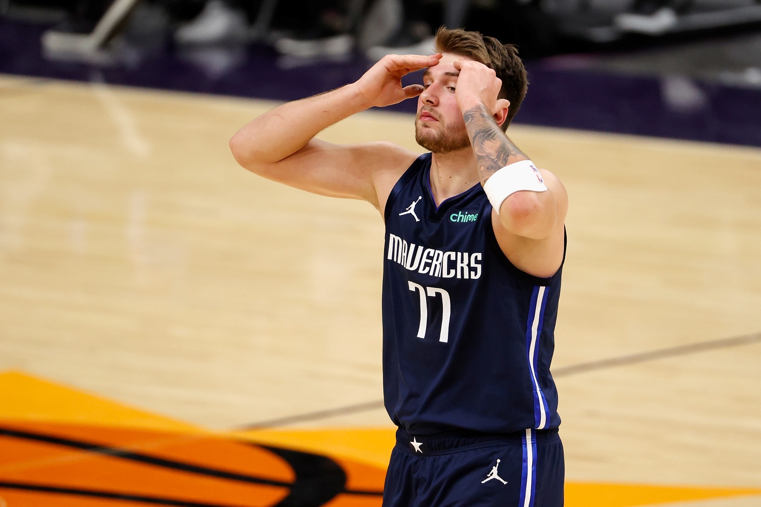 Luka Doncic of the Dallas Mavericks reacts to a foul call during the second half of the NBA game against the Phoenix Suns.