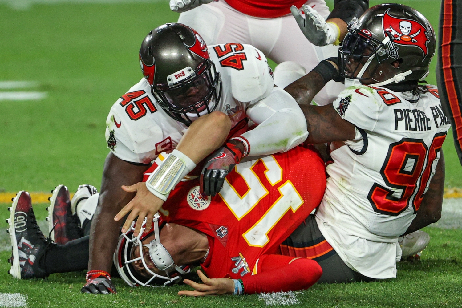 Chiefs quarterback Patrick Mahomes gets sacked by Buccaneers defenders Jason Pierre-Paul and Devin White in Super Bowl 55.