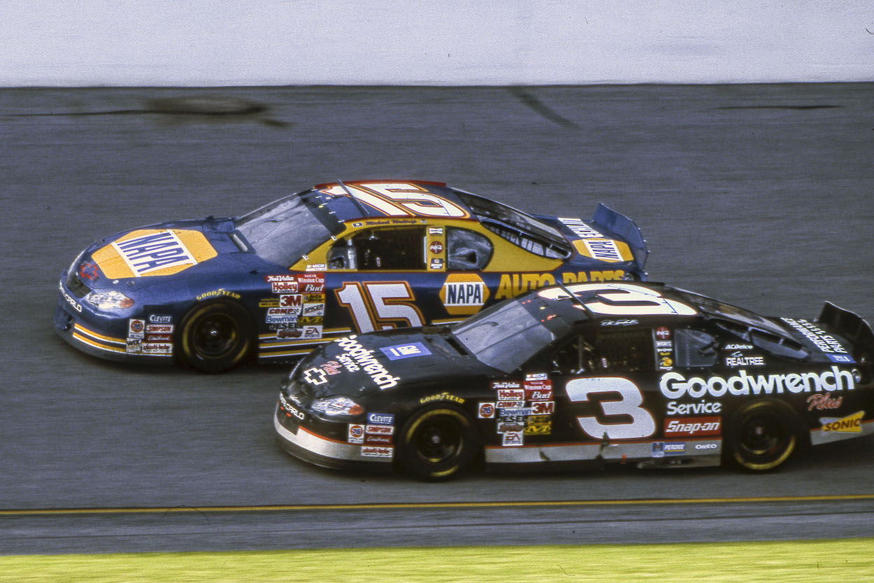 Two NASCAR drivers race around the track
