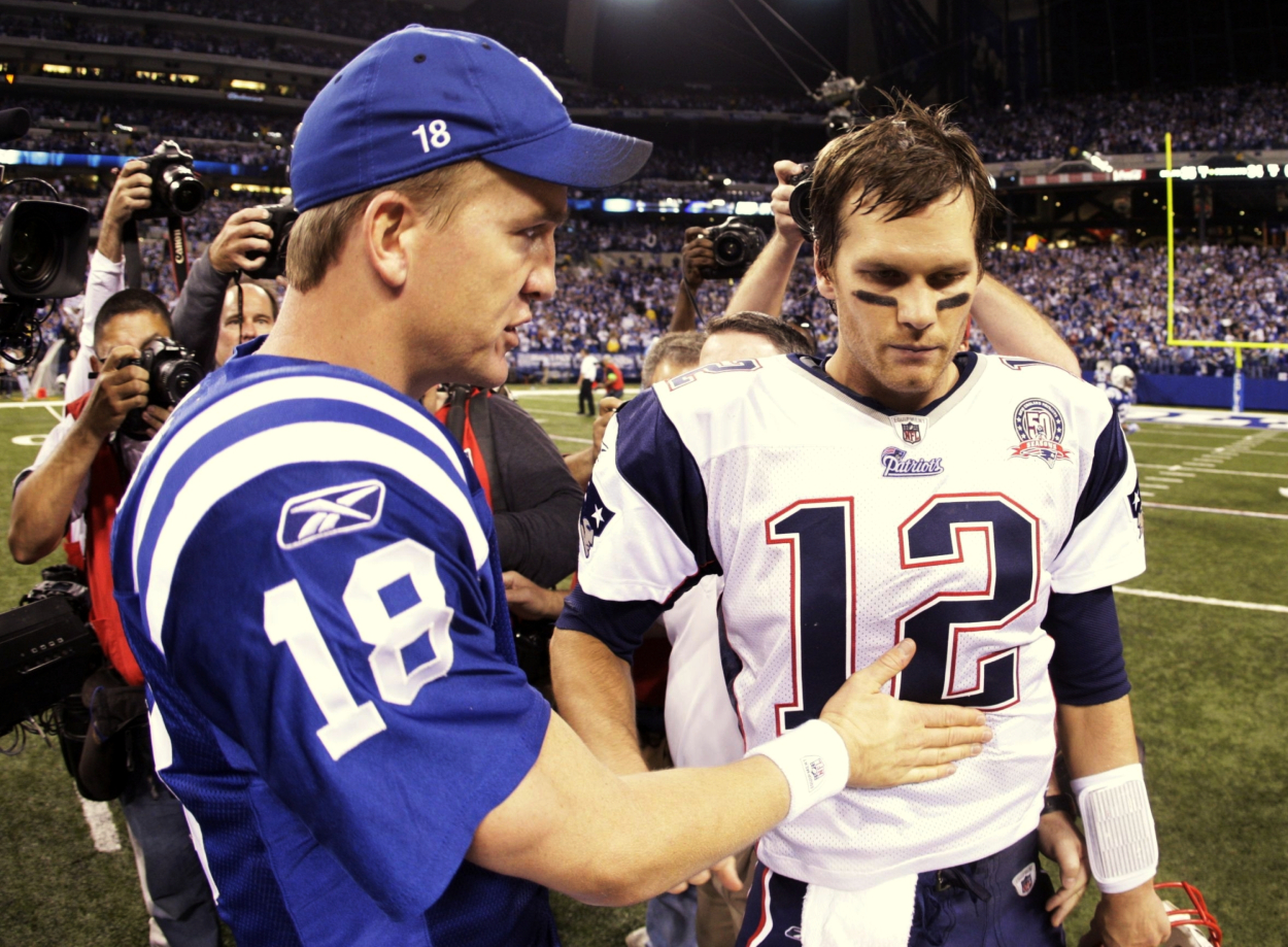 Peyton Manning talks to Tom Brady after a Colts' win over the Patriots.