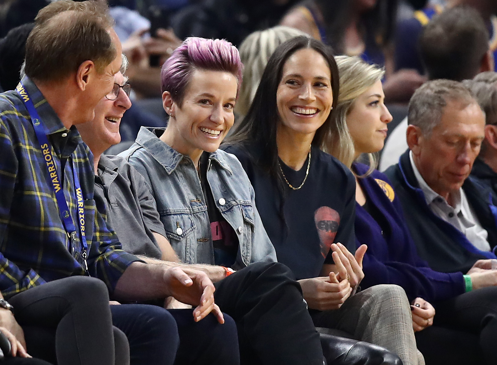 Sports power couple Megan Rapinoe and WNBA star Sue Bird watch an NBA game