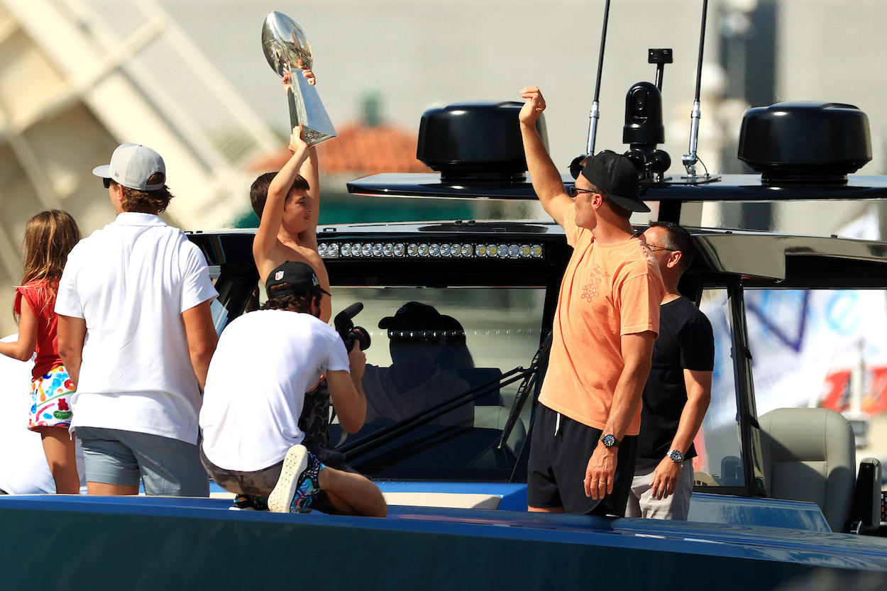 Tom Brady of the Tampa Bay Buccaneers throws Lombardi Trophy