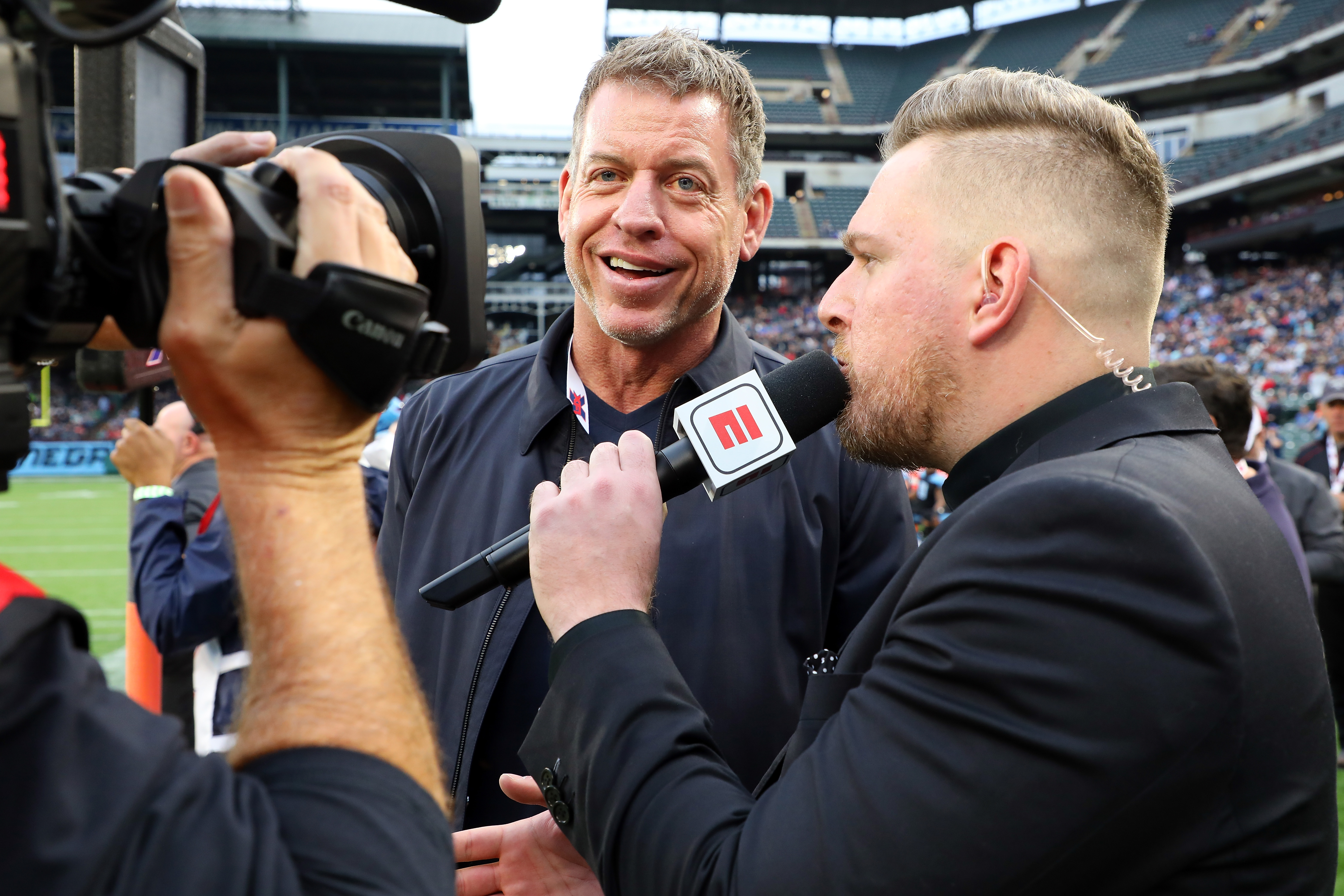 Troy Aikman is interviewed by Pat McAfee during a 2020 XFL football game