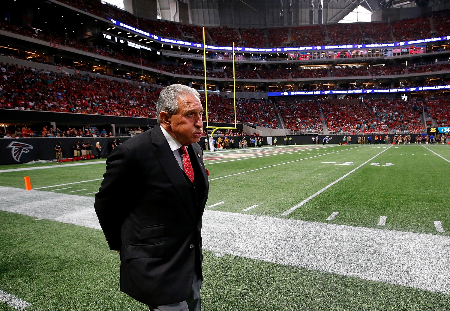 Atlanta Falcons owner Arthur Blank walks the sidelines during a game against the Miami Dolphins from the 2017 NFL season.