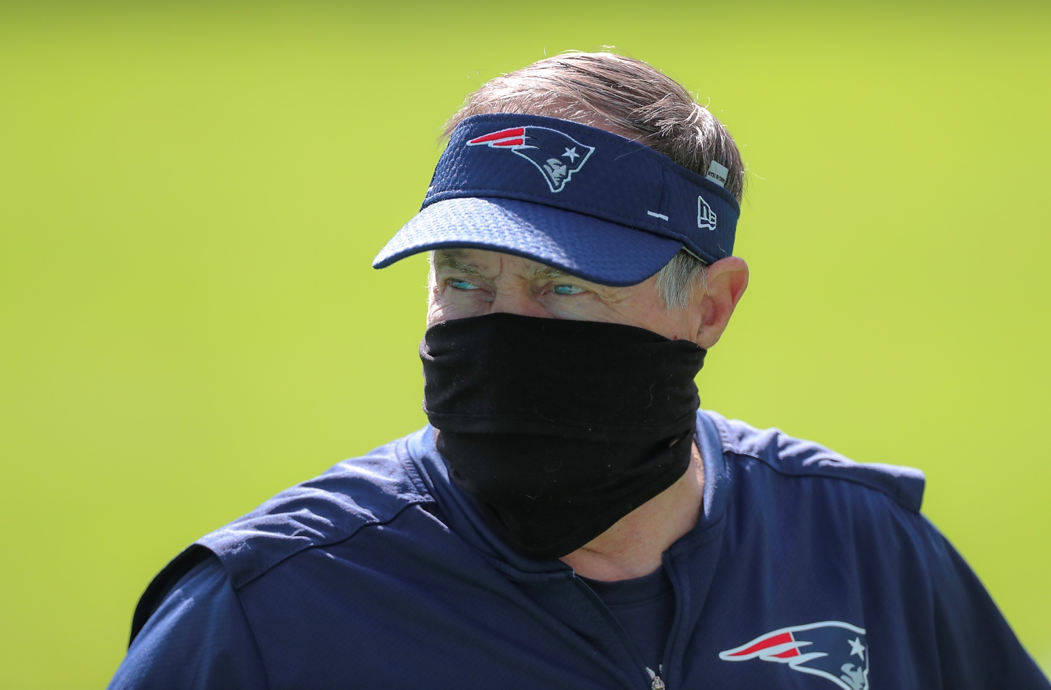New England Patriots head coach Bill Belichick walks off the field after pre game warmups before they play the Miami Dolphins.