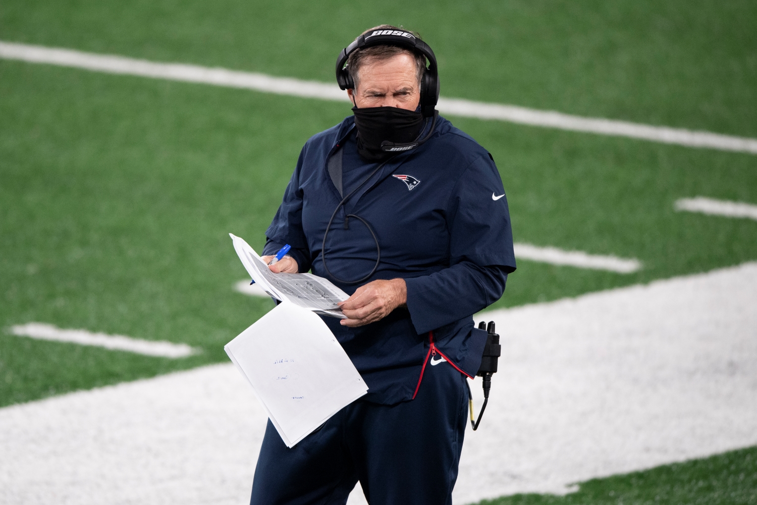 New England Patriots coach Bill Belichick stands on the sideline during a game against the New York Jets during the 2020 NFL season.