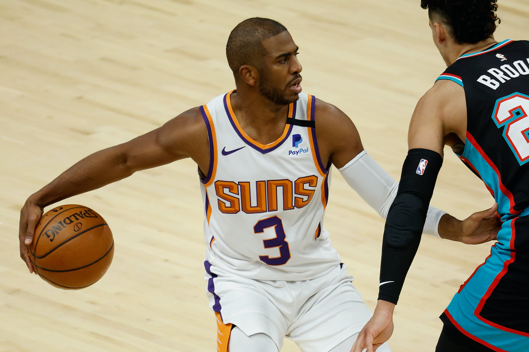 Phoenix Suns guard Chris Paul dribbles the ball up the court