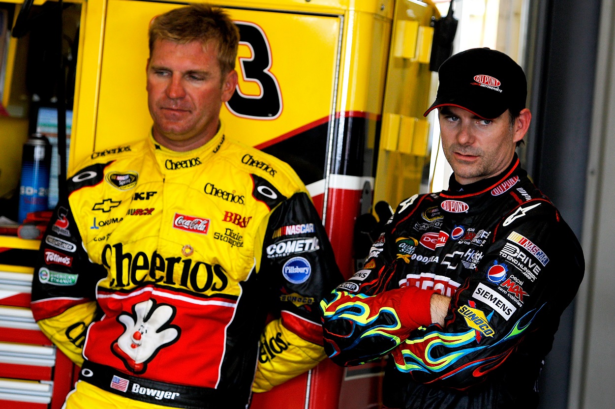 Former NASCAR drivers Clint Bowyer and Jeff Gordon ahead of a race in 2011