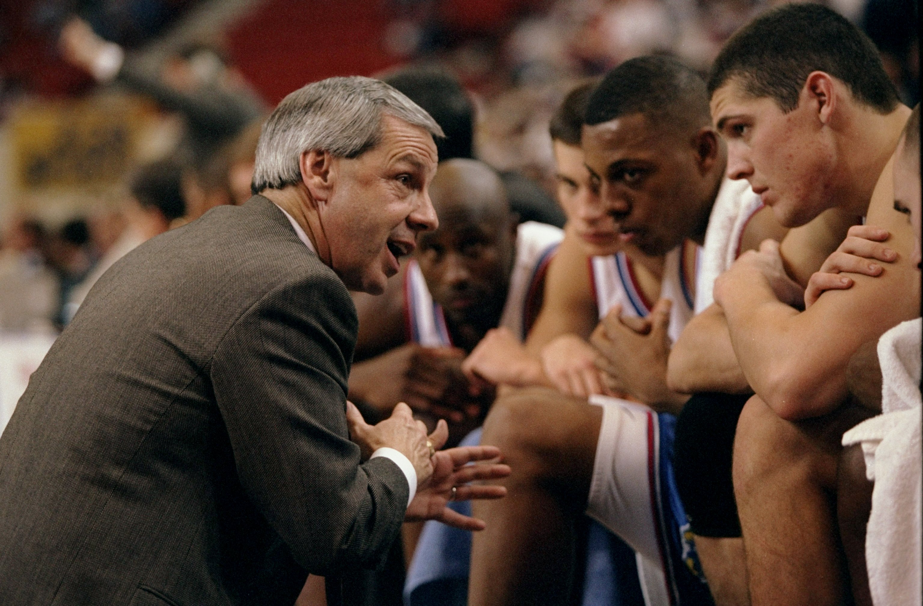 Coach Roy Williams of the Kansas Jayhawks talks to his team in 1998