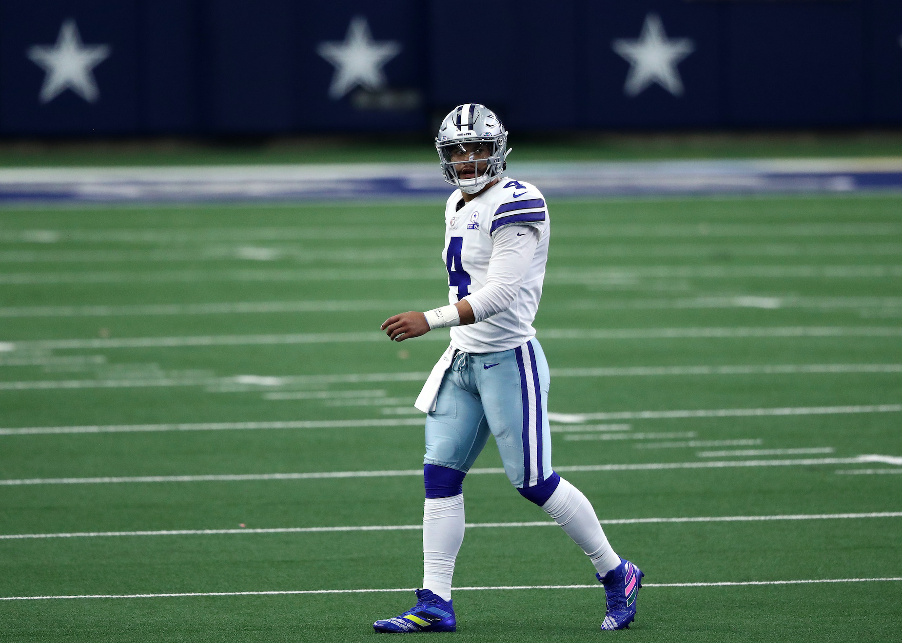 Dallas Cowboy quarterback Dak Prescott walks off the field.