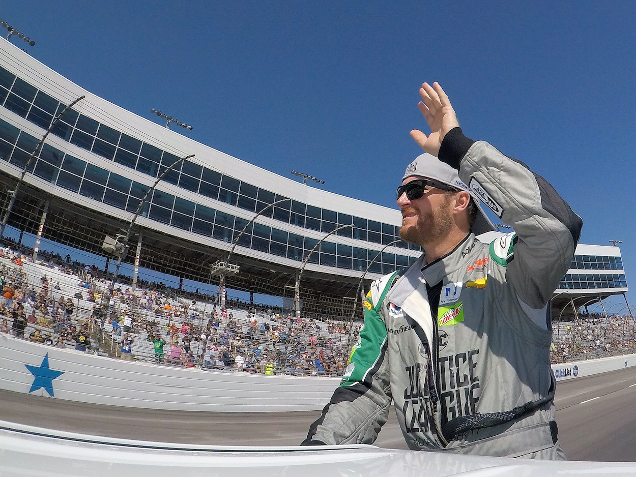 Dale Earnhardt Jr. waves to the NASCAR crowd