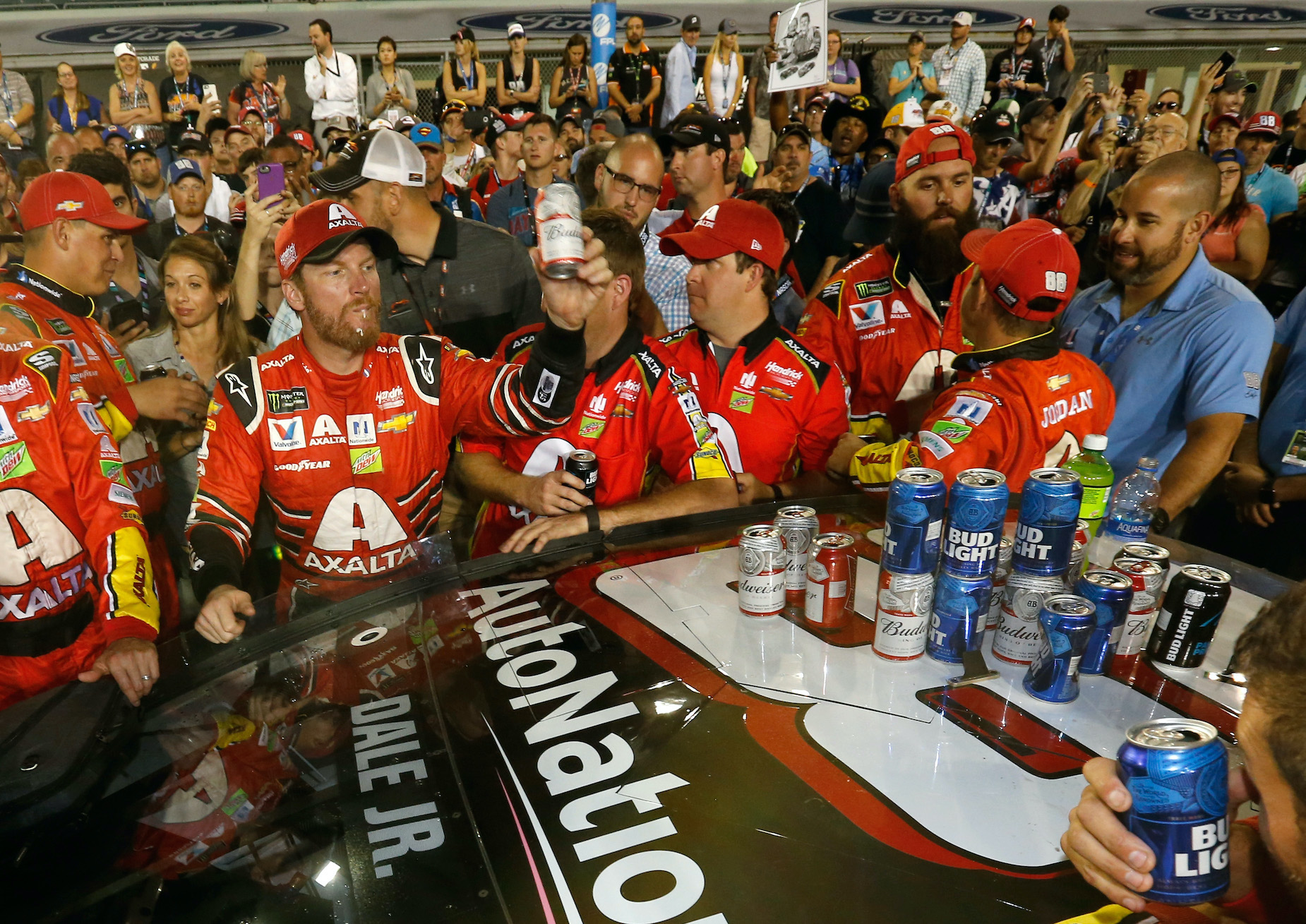 Dale Earnhardt Jr. celebrates a NASCAR win with a beer