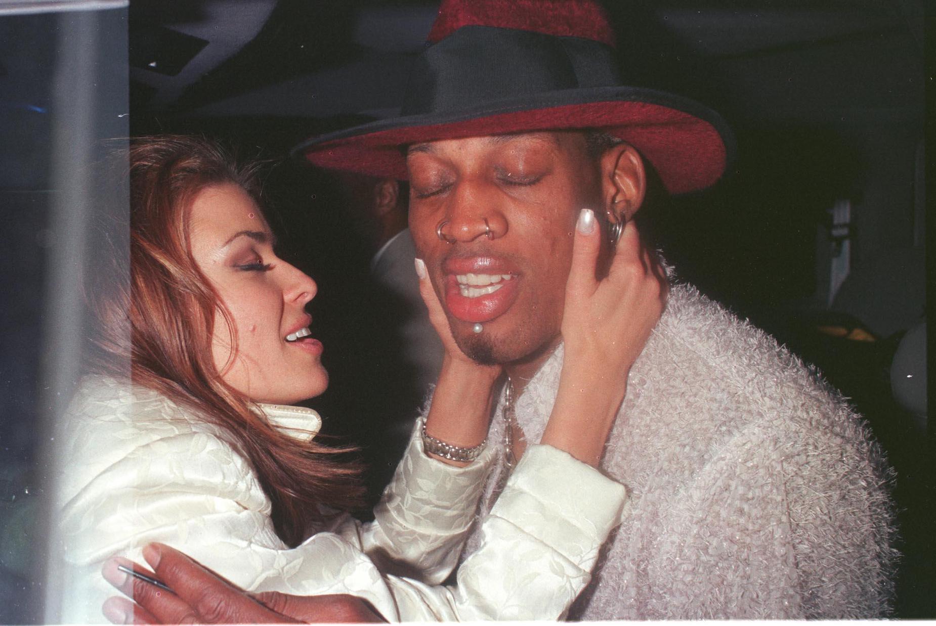 Dennis Rodman and Carmen Electra embrace in Beverly Hills during their time together.