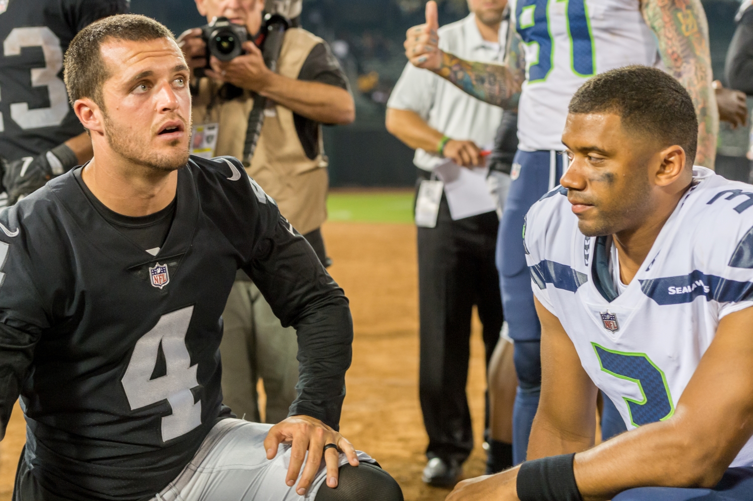 Derek Carr of the Las Vegas Raiders and Russell Wilson of the