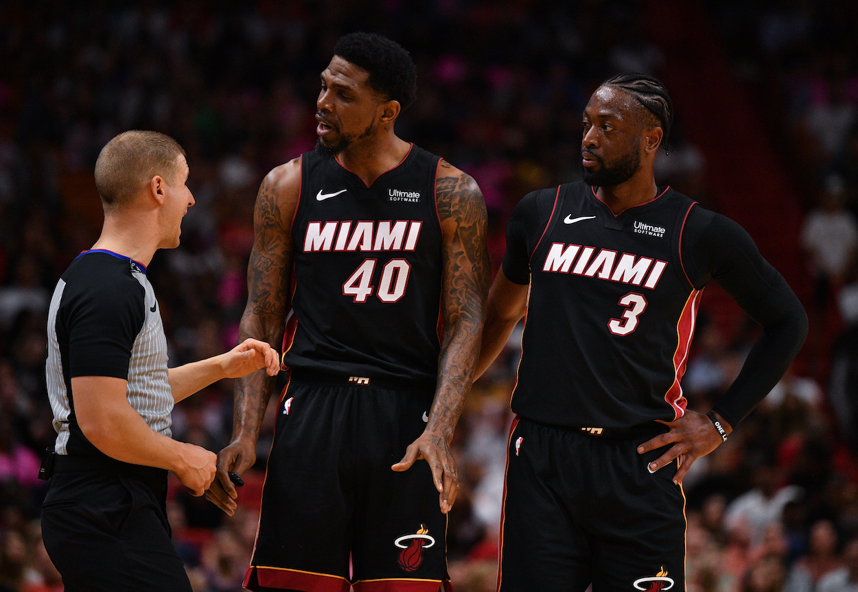 Dwyane Wade and Udonis Haslem talk to referee