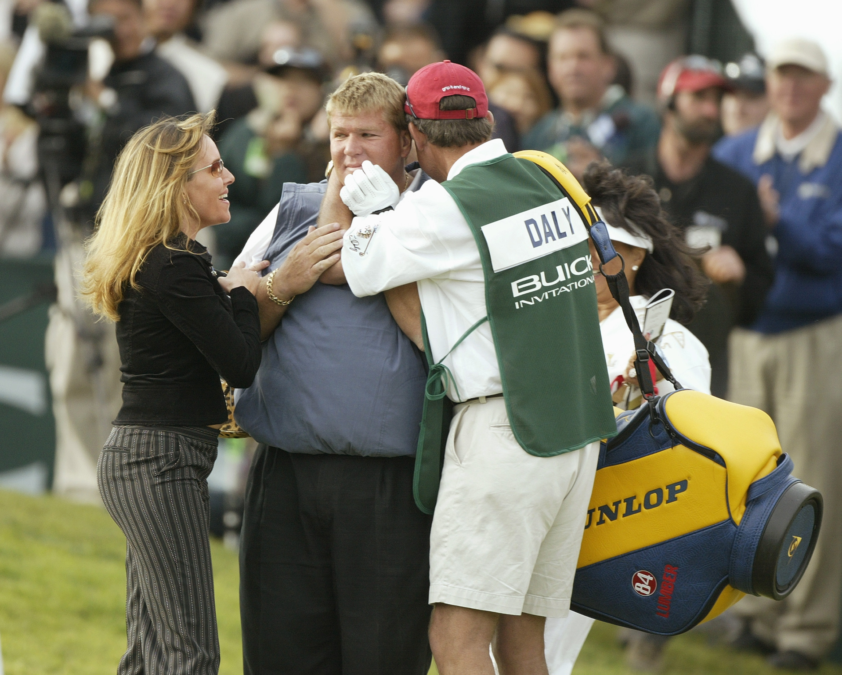 John Daly with his wife Sherrie Daly and caddie after winning the 2004 Buick Invitational