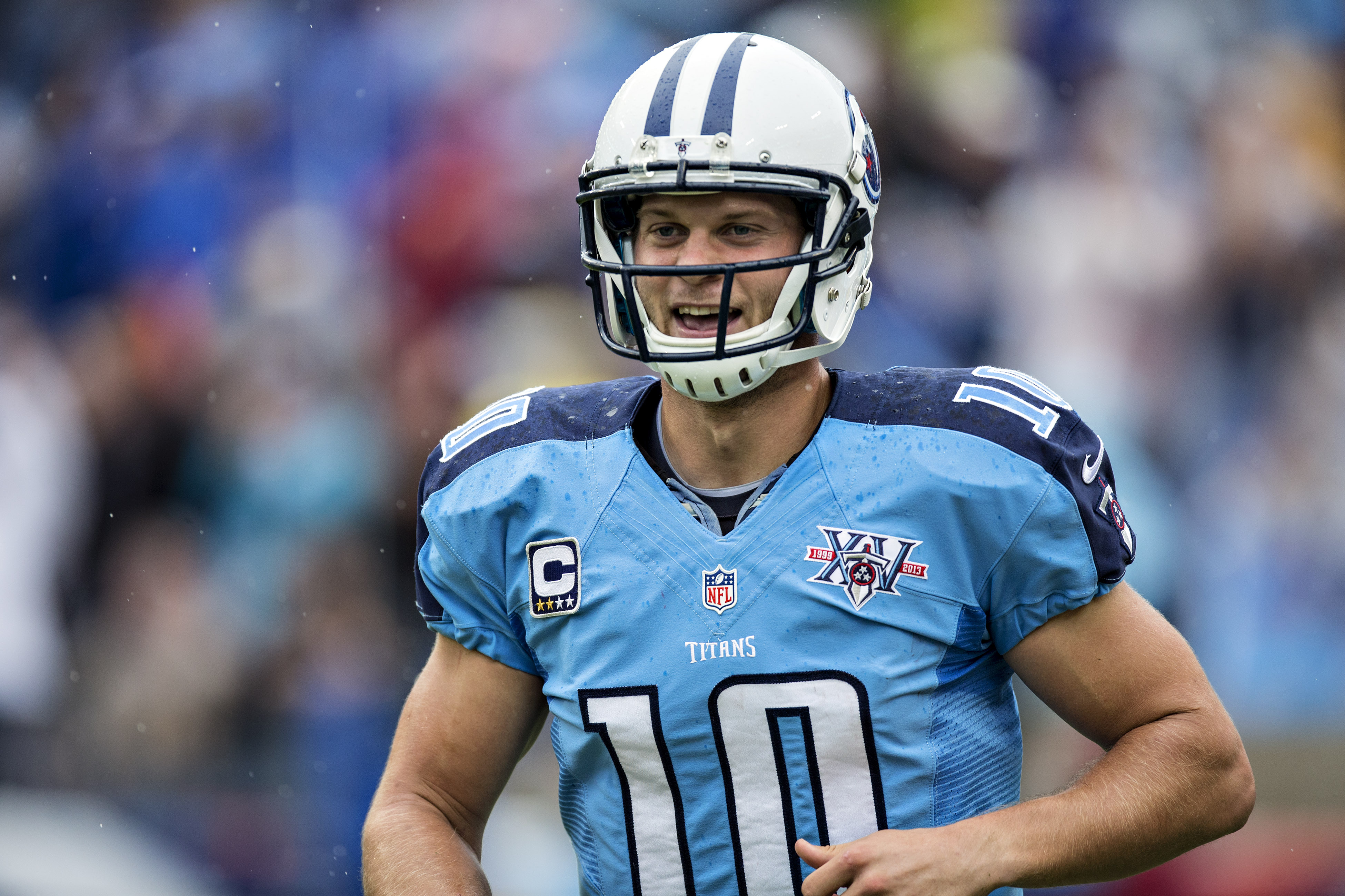 Jake Locker of the Tennessee Titans jogs off the field