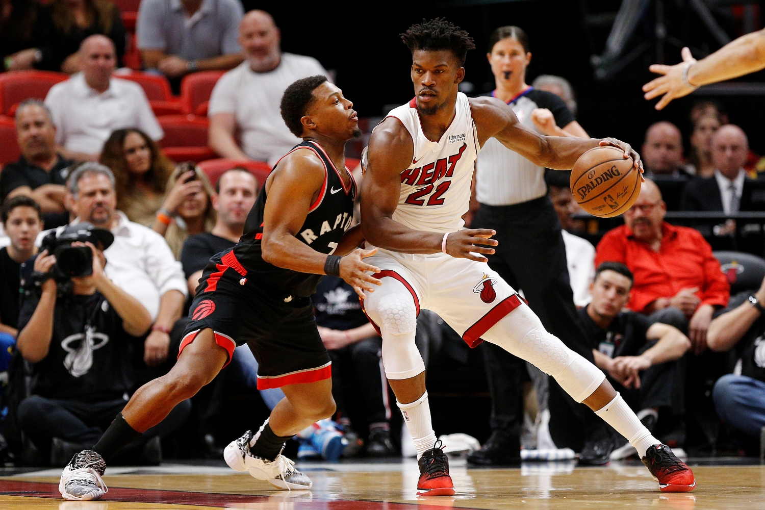 Jimmy Butler posts up against Kyle Lowry in a game between the Miami Heat and the Toronto Raptors on Jan. 2, 2020.