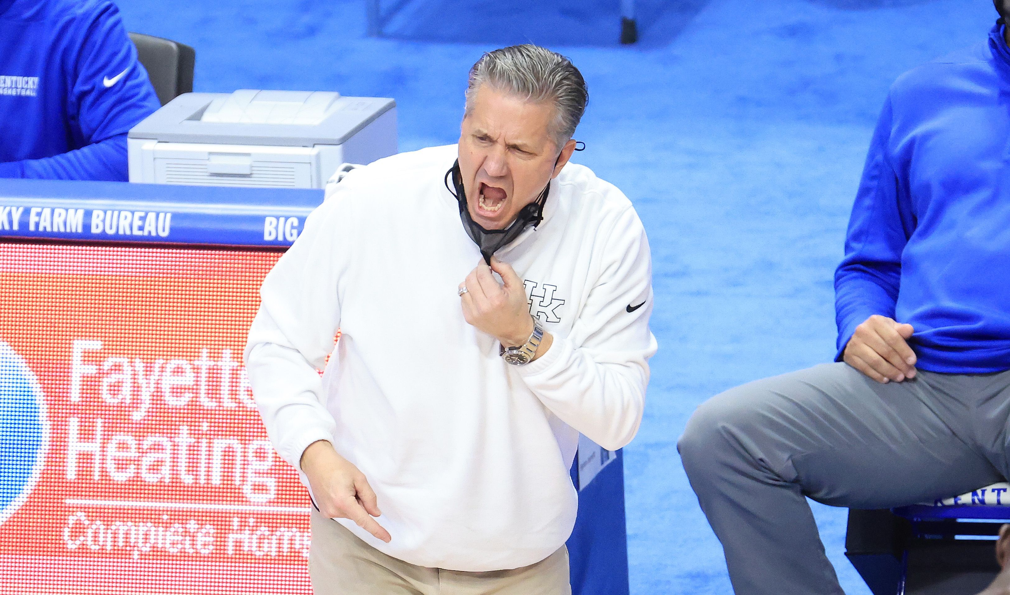Head coach John Calipari of the Kentucky Wildcats gives instructions to his team