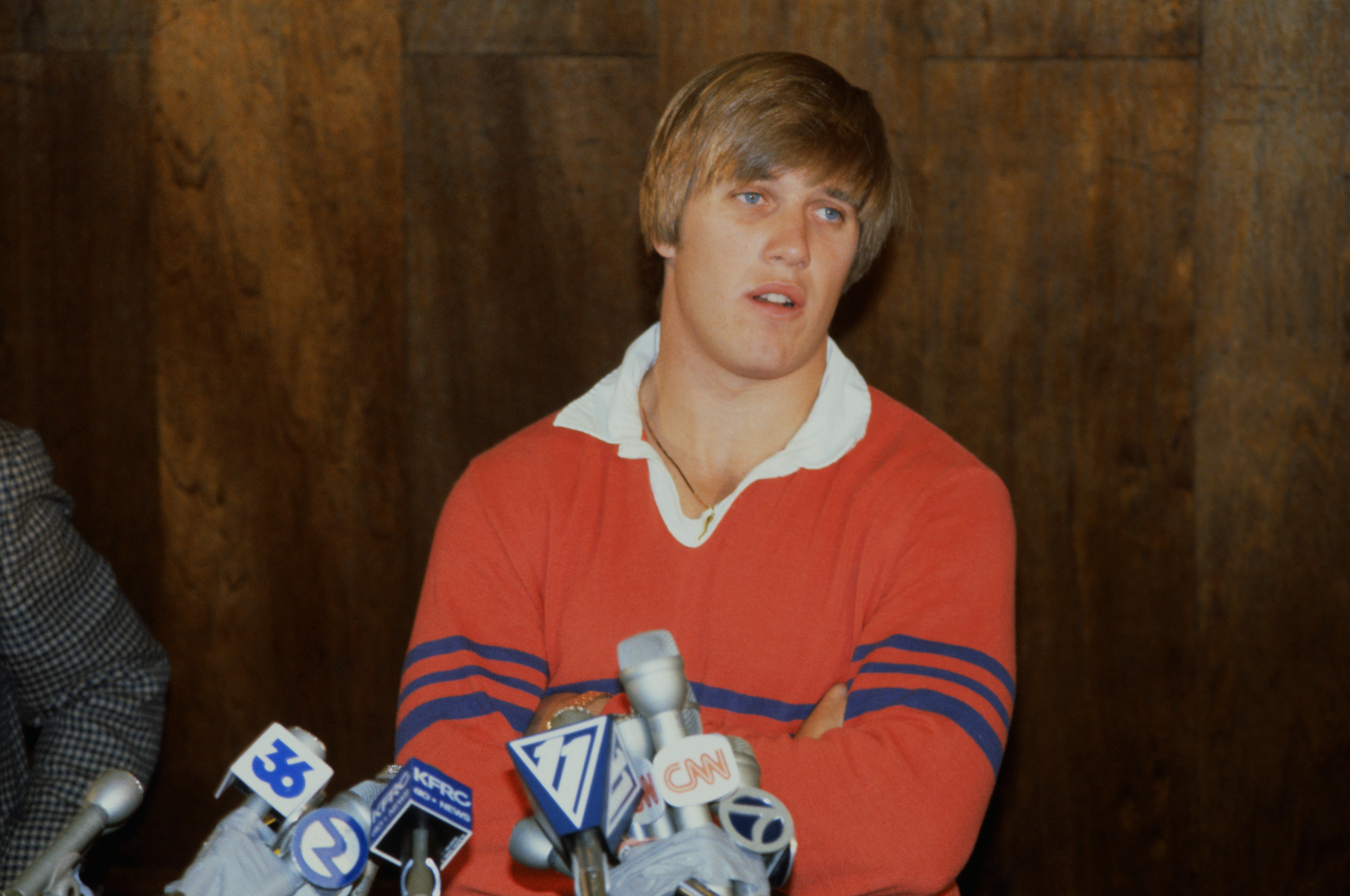 Quarterback John Elway speaks to reporters after reaching a deal with the Broncos