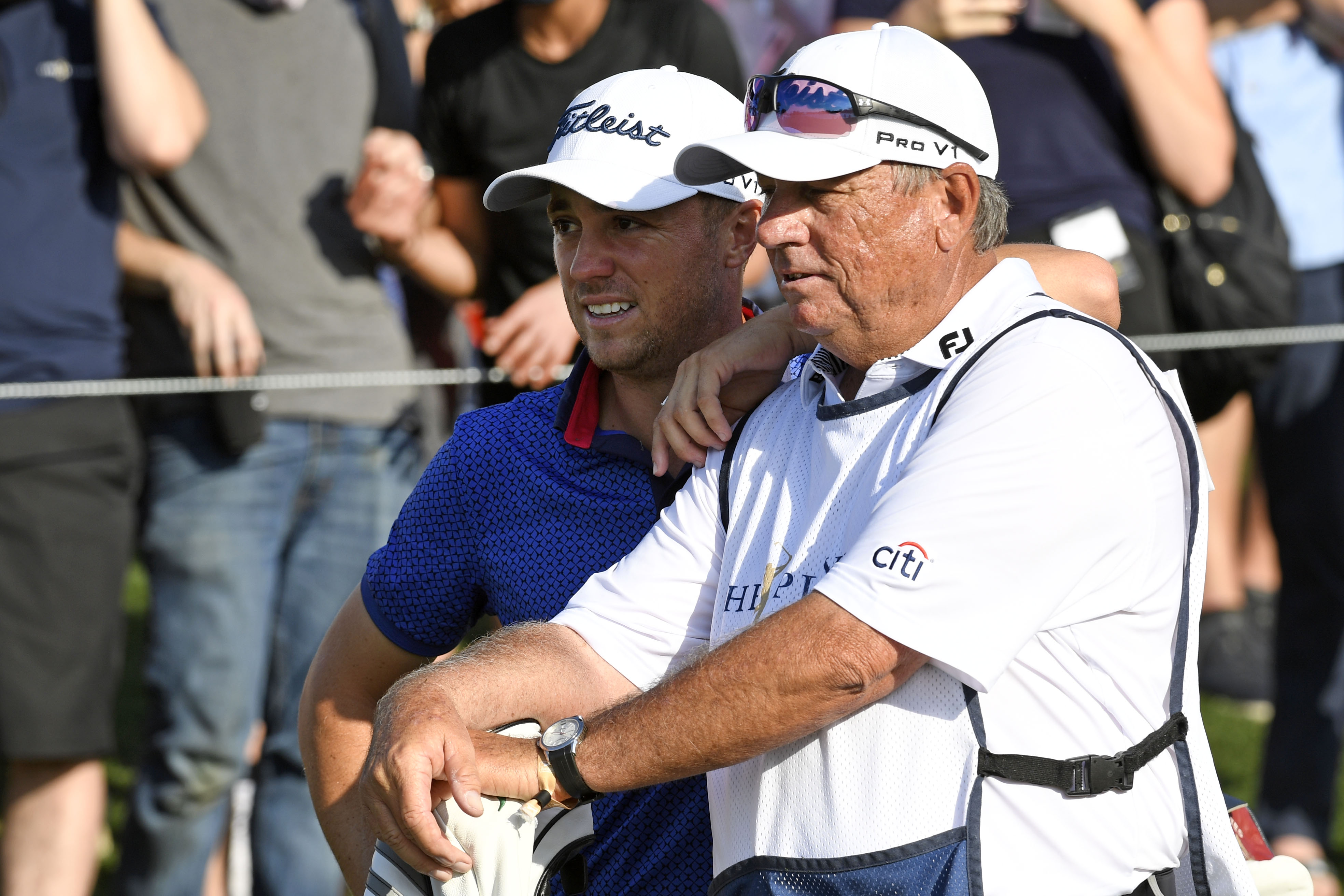 Justin Thomas reacts with his caddie Jimmy Johnson during the final round of the 2021 Players Championship