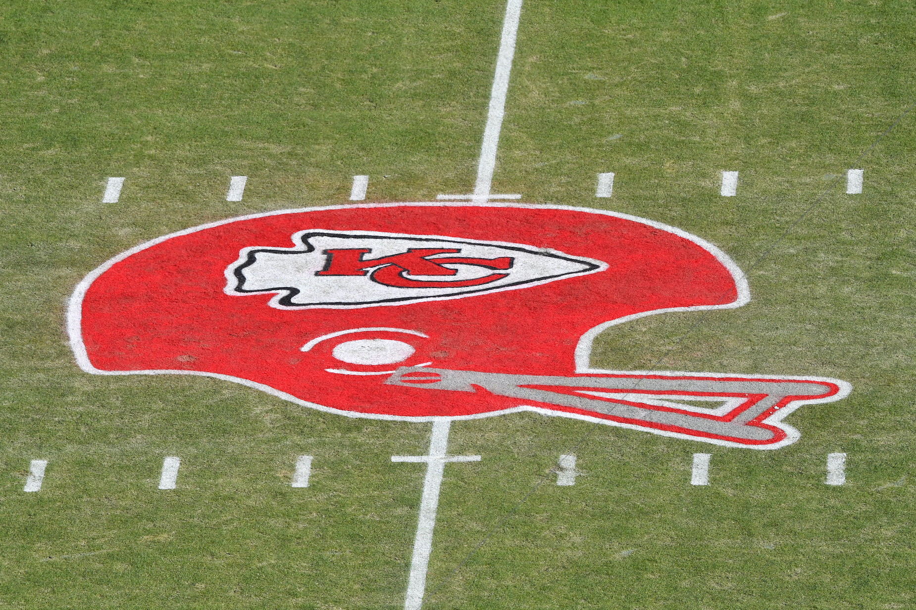 A Kansas City Chiefs helmet painted on the field at Arrowhead Stadium