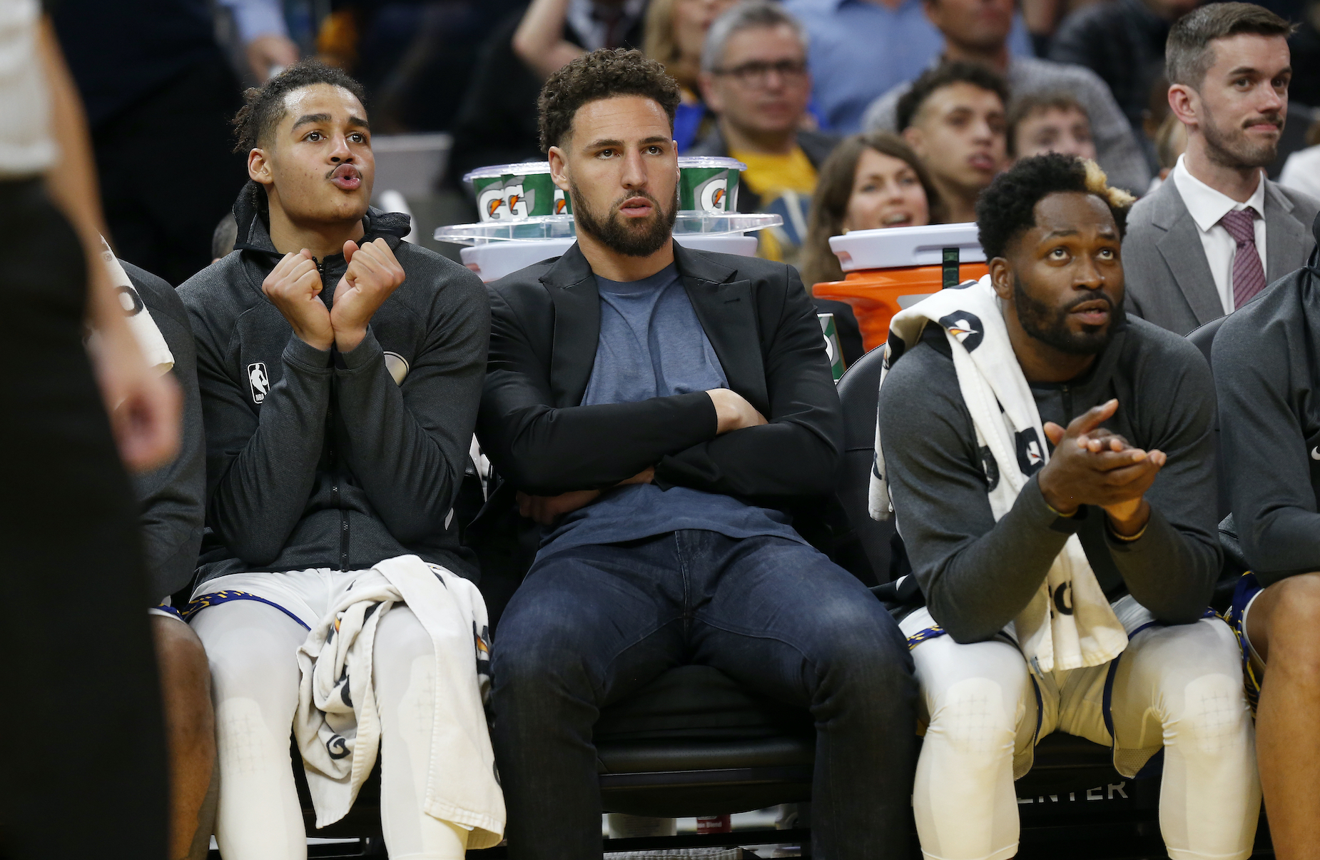 Golden State Warriors star Klay Thompson watches from the sidelines as he recovers from an injury