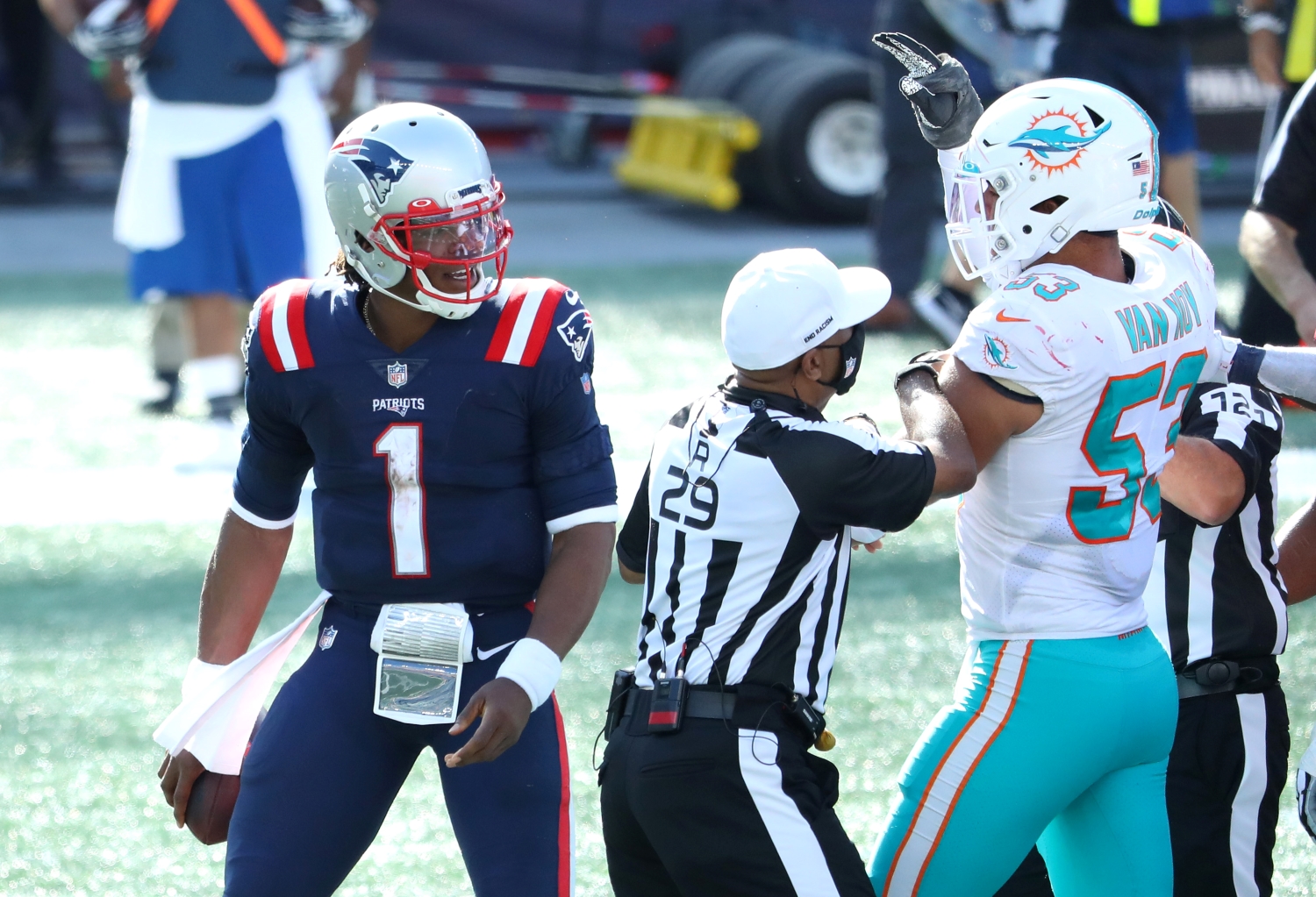 Cam Newton of the New England Patriots and Kyle Van Noy of the Miami Dolphins are involved in an altercation following their game at Gillette Stadium on September 13, 2020.