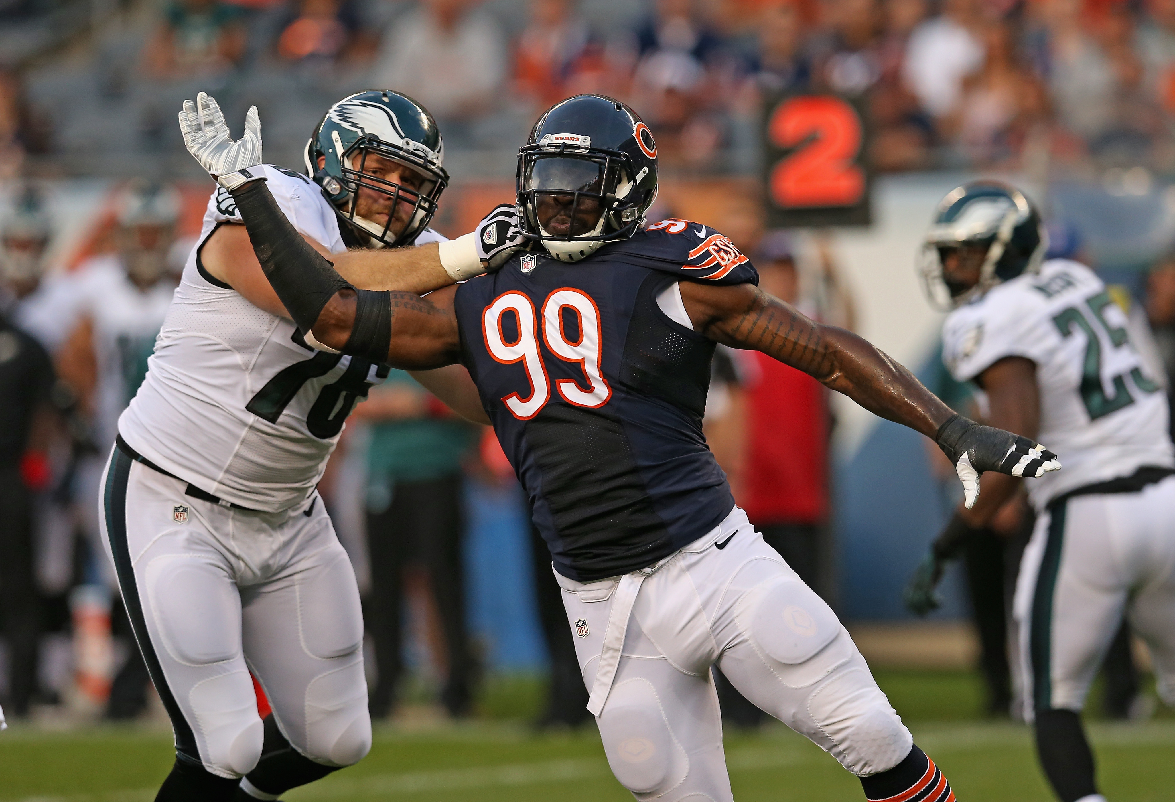 Lamarr Houston of the Chicago Bears works his way around Allen Barbe of the Philadelphia Eagles in 2014