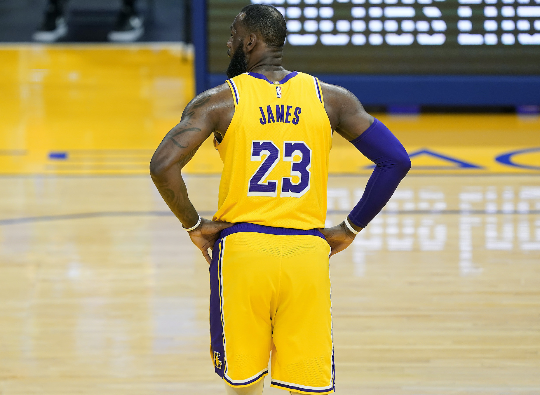 LeBron James stands on the court for the LA Lakers.