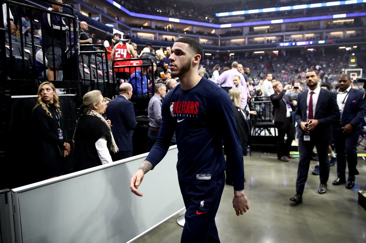 New Orleans Pelicans guard Lonzo Ball walks off the court after a game against the Sacramento Kings was postponed.