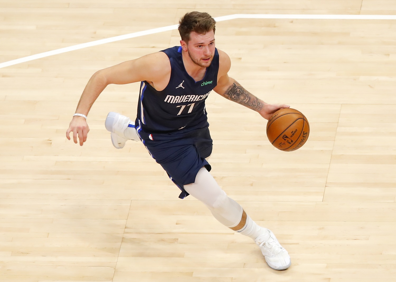 Third-year Dallas Mavericks guard Luka Doncic, frequently compared to Larry Bird, drives to the basket during a February 2021 game.
