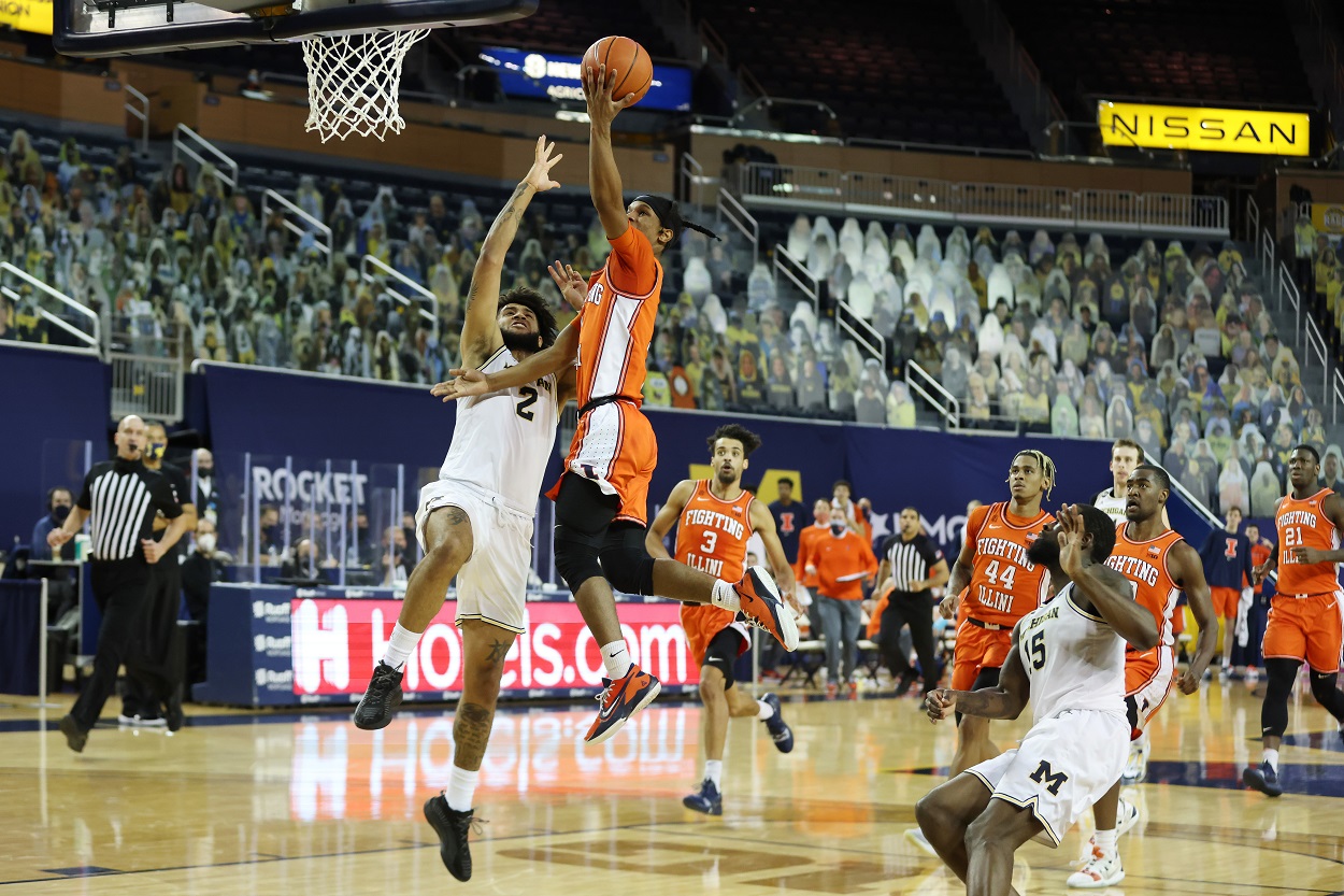 Illinois Fighting Illini guard Trent Frazier drives to the basket against Michigan Wolverines forward Isaiah Livers