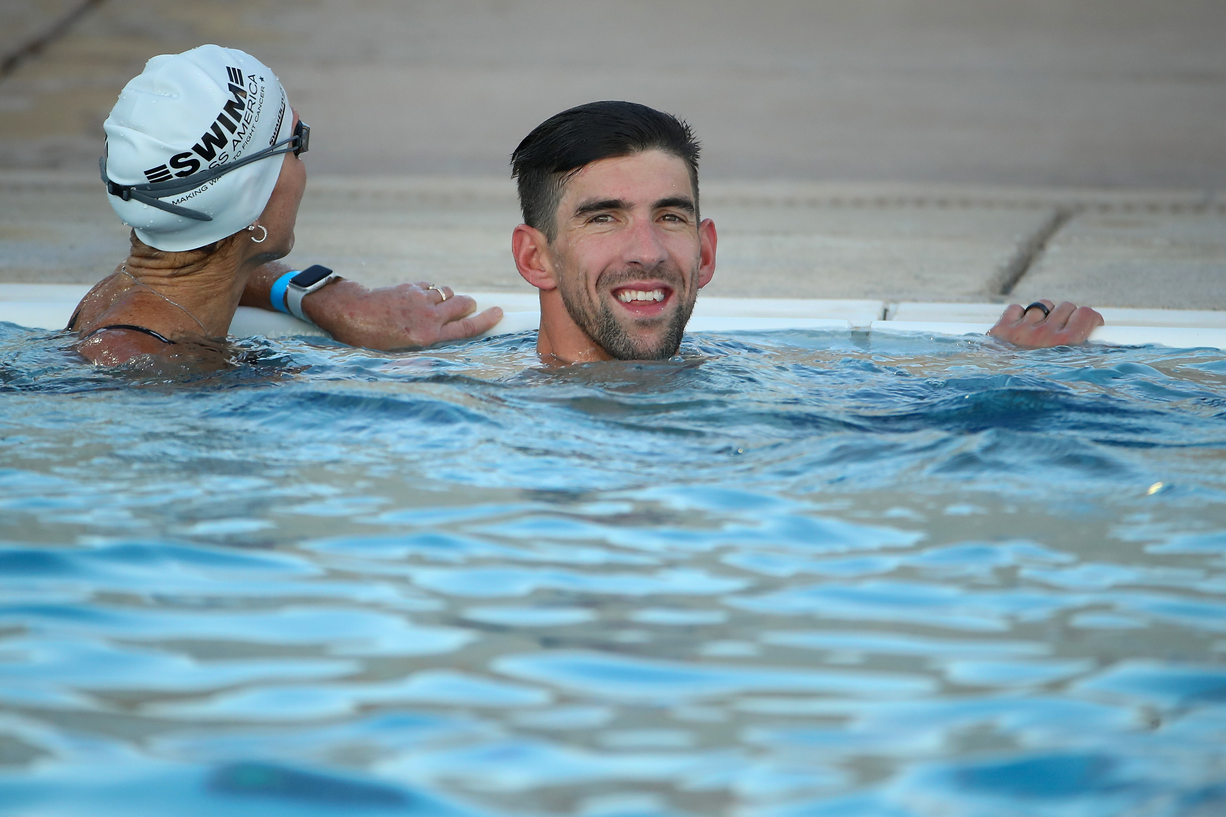 28 time-Olympic medalist Michael Phelps participates in a charity swim in 2019