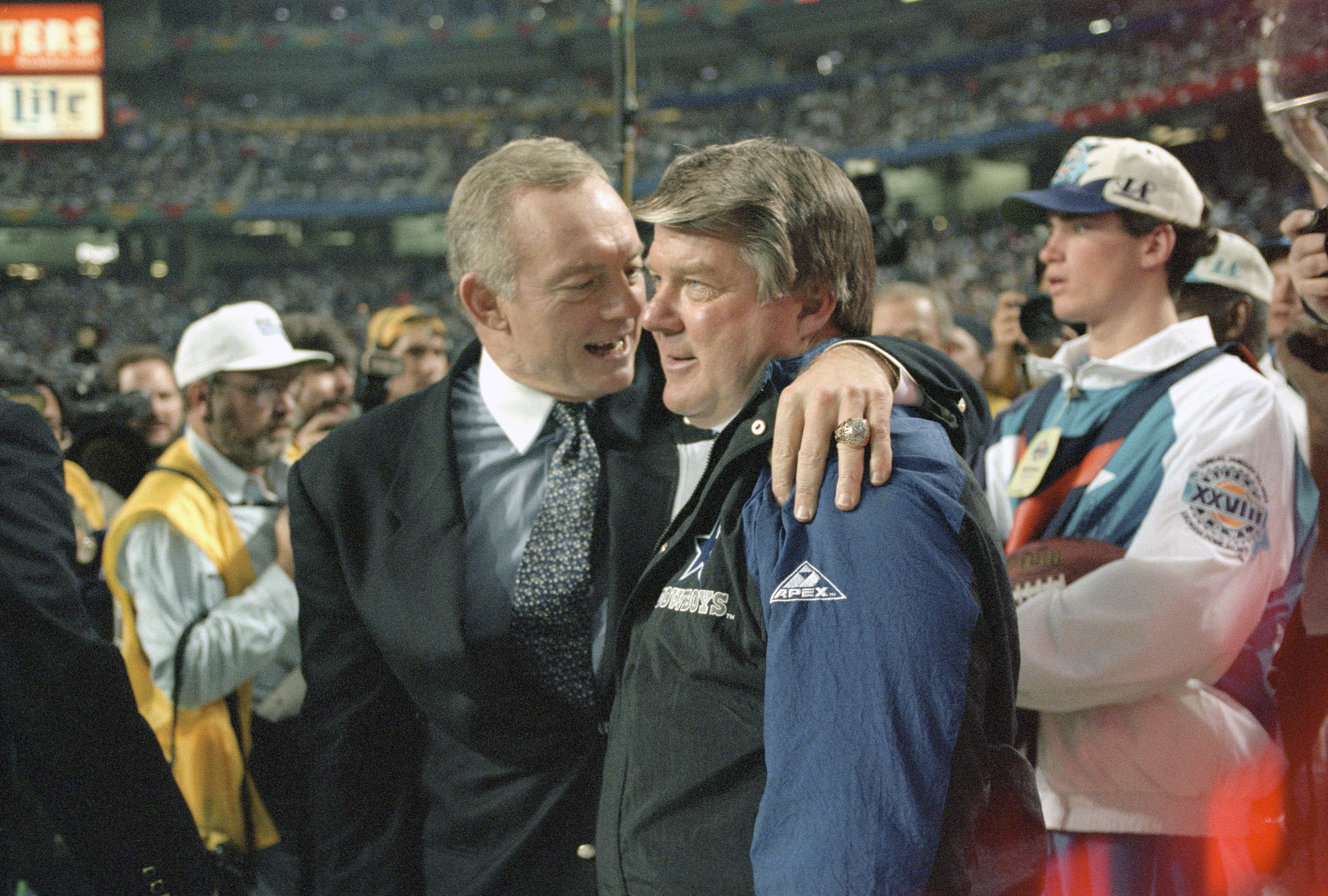 Owner Jerry Jones of the Dallas Cowboys (L) hugs head coach Jimmy Johnson as the Cowboys win Super Bowl XXVIII in 1994