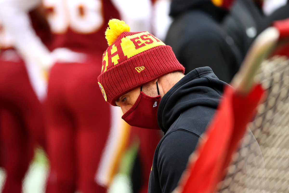 Alex Smith of the Washington Football Team looks on