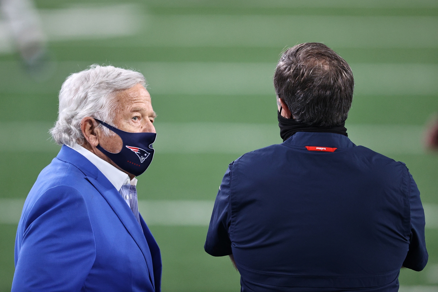 Patriots owner Robert Kraft stands next to head coach Bill Belichick during warmups before a game against the New York Jets from the 2020 NFL season.