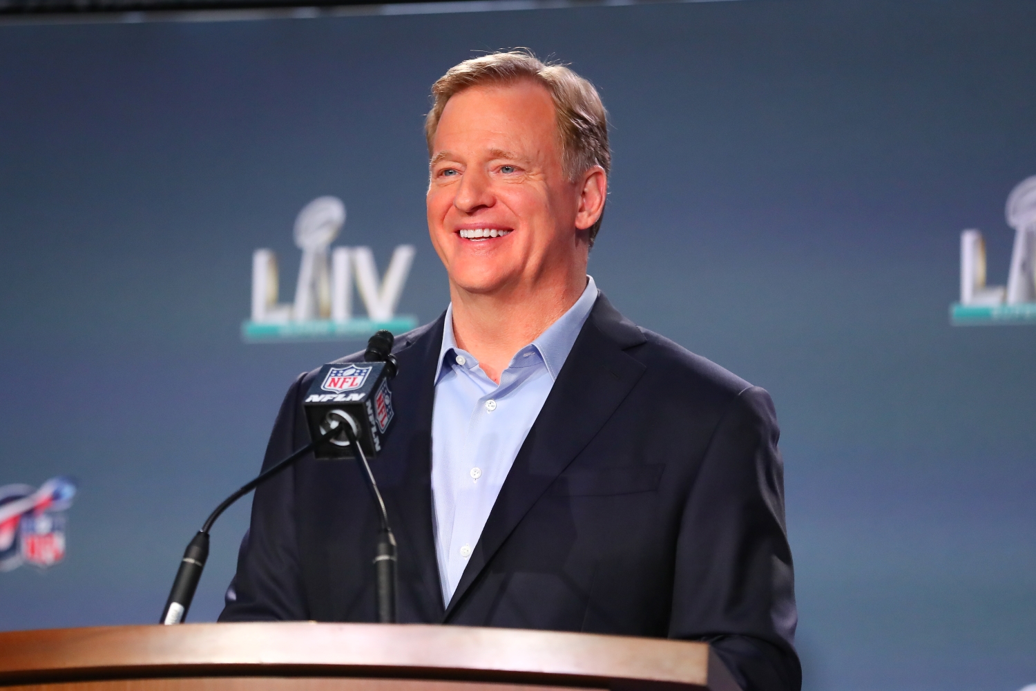 NFL commissioner Roger Goodell smiles at the podium.