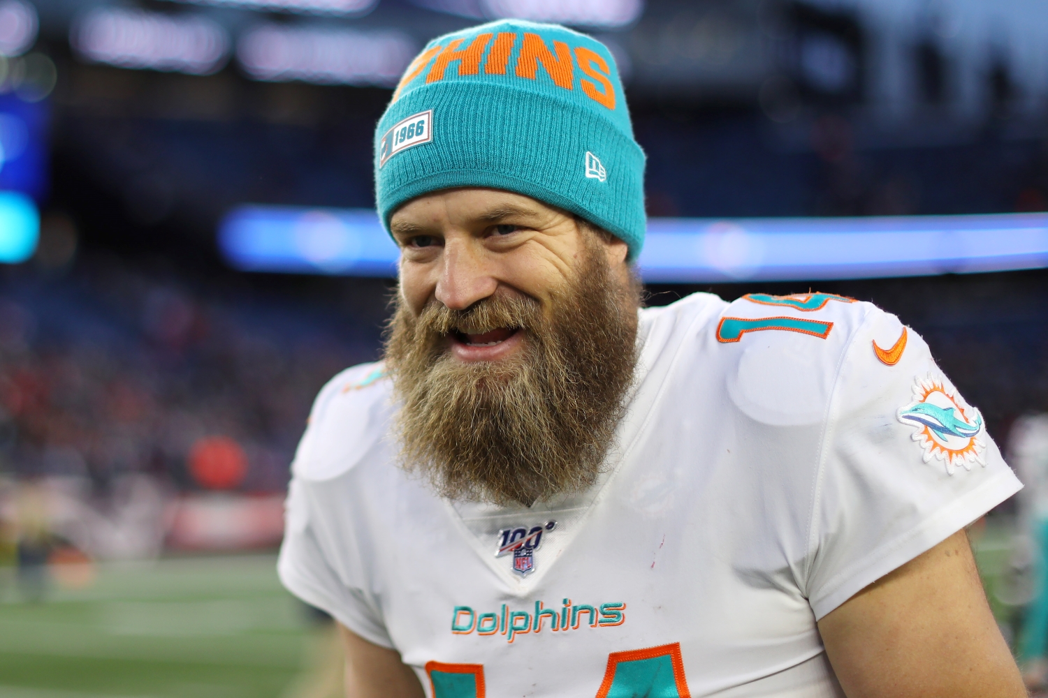 Ryan Fitzpatrick smiles as he leaves the field after the Miami Dolphins defeated the New England Patriots on Dec. 29, 2019.
