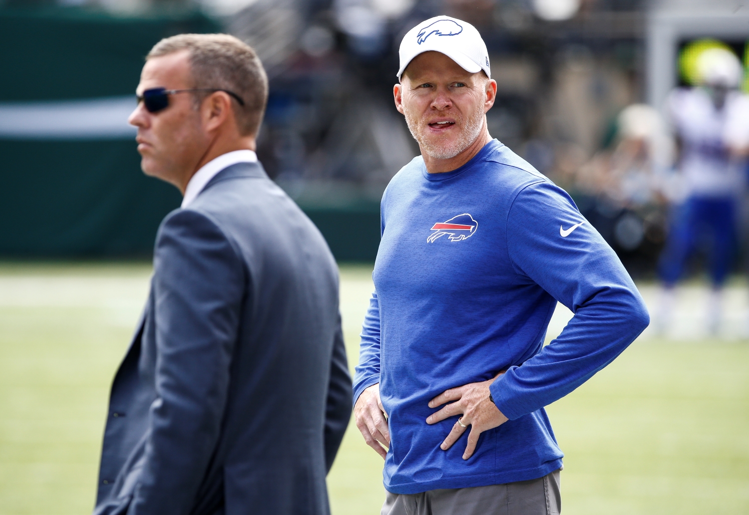 Head coach Sean McDermott of the Buffalo Bills stands with general manager Brandon Beane on the field before a game against the New York Jets during the 2019 NFL season.