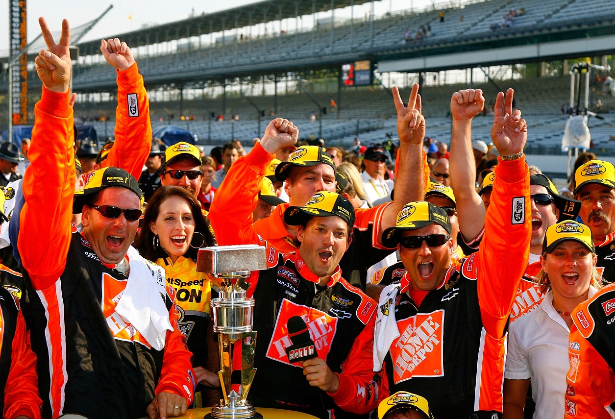 Tony Stewart and his crew celebrate their 2007 Brickyard 400 win