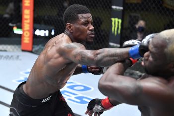 Kevin Holland punches Derek Brunson in their middleweight fight