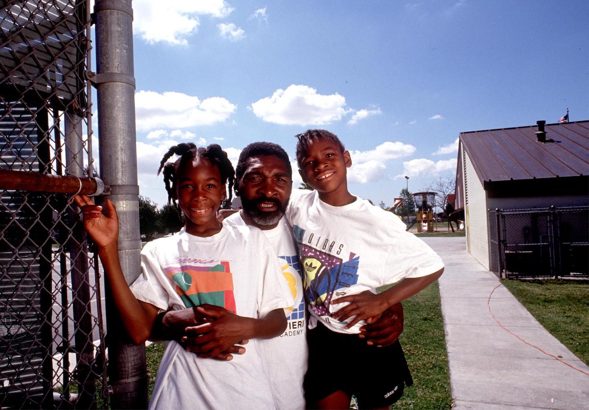 Tennis coach Richard Williams poses with his duaghters, Venus and Serena Williams