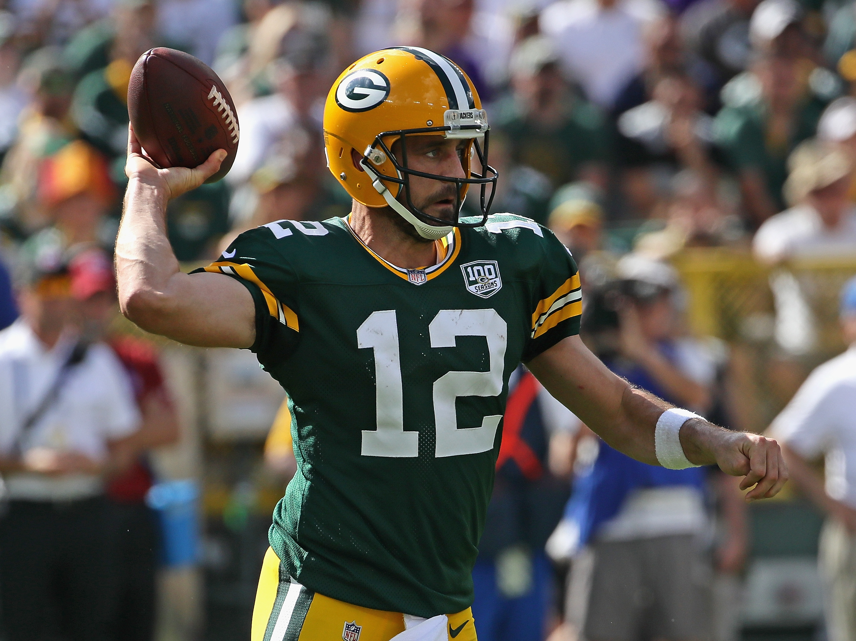 Aaron Rodgers is taking the spotlight away from college football stars and Tim Tebow.