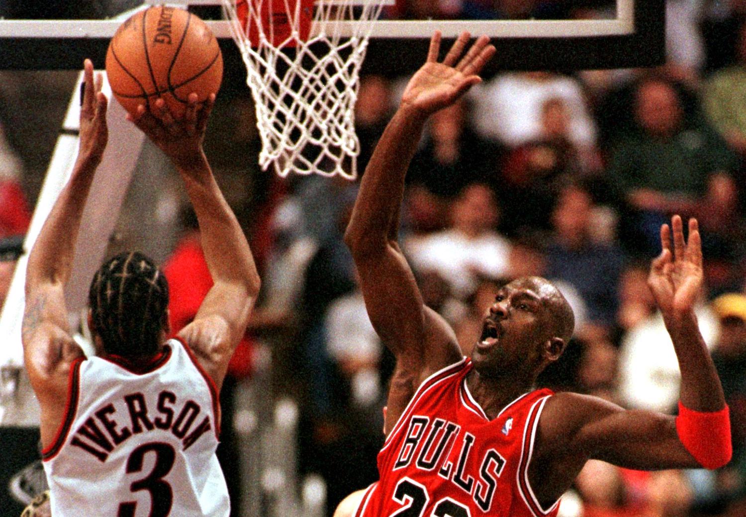 Philadelphia 76ers guard Allen Iverson shoots over Michael Jordan in 1998