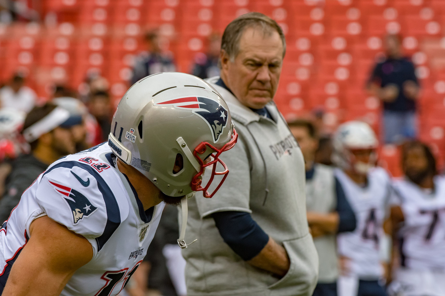 New England Patriots head coach Bill Belichick looks at receiver Julian Edelman
