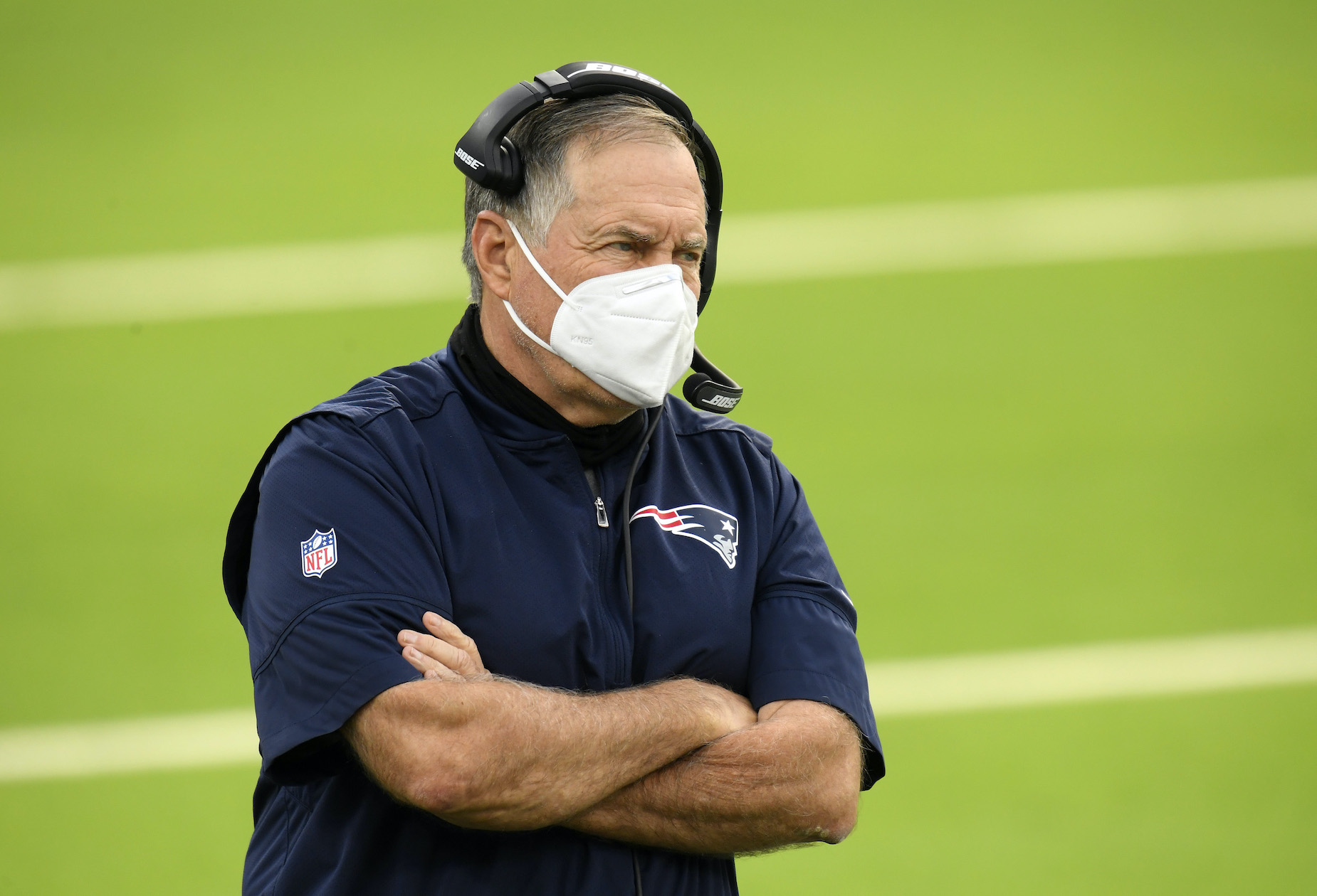 New England Patriots head coach Bill Belichick stands on the sidelines during a 2020 NFL game.