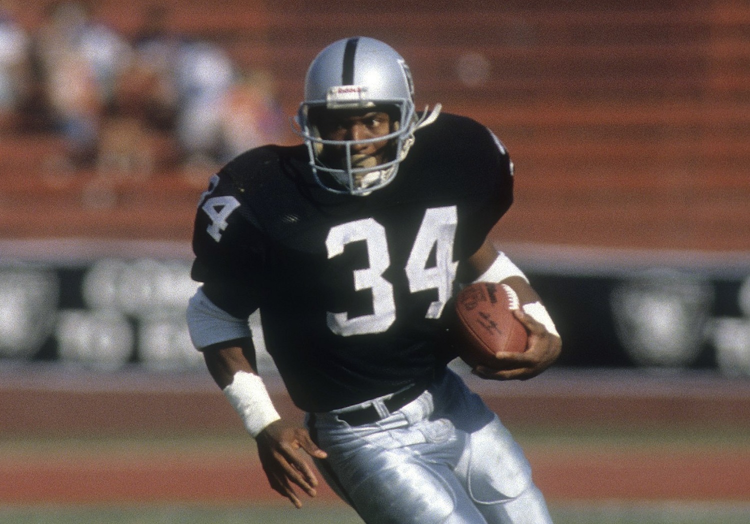Running back Bo Jackson didn't sign with the Tampa Bay Buccaneers after they made him the No. 1 overall draft pick. He went back into the draft the following year, and the Raiders took him in the seventh round. | Focus on Sport/Getty Images